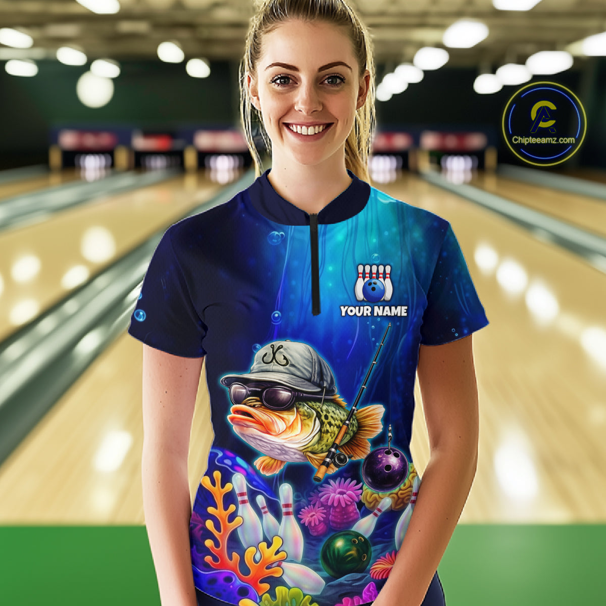 Woman wearing an underwater-themed bowling quarter zip featuring a fish mascot wearing sunglasses and a cap, colorful coral reefs, bowling pins, bowling balls, and custom your text.