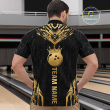 Load image into Gallery viewer, Men wearing personalized bowling quarter zip shirt with a crowned bowling ball centered among geometric gold patterns across a black layout.