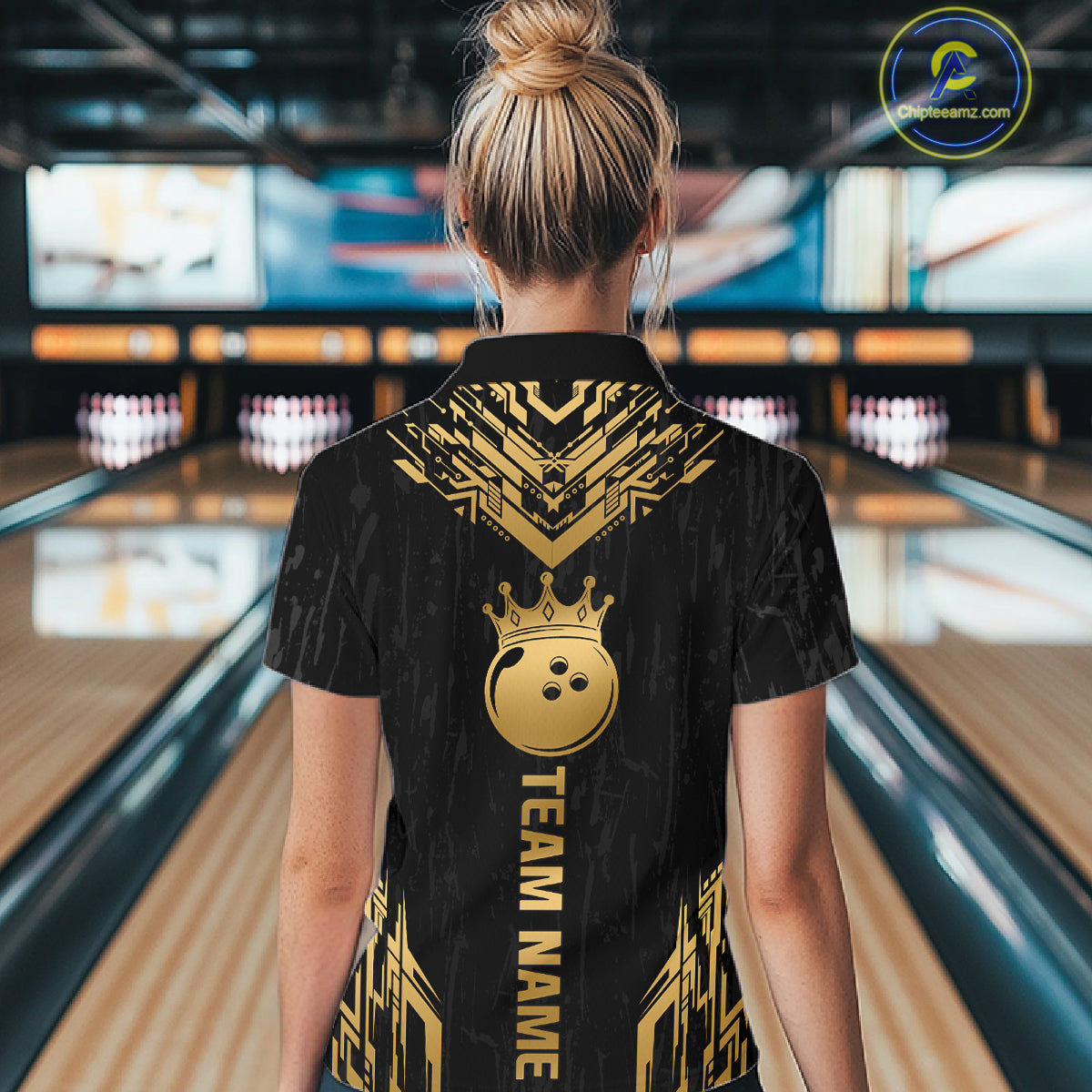 Women wearing personalized bowling polo shirt with a crowned bowling ball centered among geometric gold patterns across a black layout.