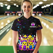 Load image into Gallery viewer, Women wearing personalized bowling quarter zip shirt with cartoon chicks holding bowling balls, framed by pins and colorful paint patterns on a black layout.
