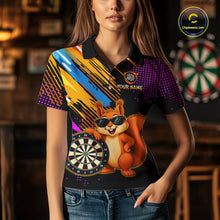 Load image into Gallery viewer, Person wearing a colorful polo shirt with a cartoon squirrel and dartboard design, set against a bar background.