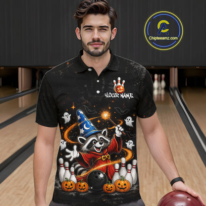 A man wearing a black short-sleeve polo shirt with a colorful Halloween-themed graphic print featuring a raccoon, pumpkins, ghosts, bowling pins, and a wizard hat. The shirt has a custom name placeholder on the chest.