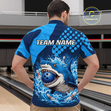 Load image into Gallery viewer, Man wearing a blue and black bowling shirt with a shark graphic and 'TEAM NAME' text on a bowling alley background.