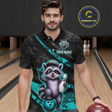 Load image into Gallery viewer, Man wearing a bowling-themed shirt with a raccoon design on a bowling alley.
