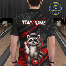 Load image into Gallery viewer, Person wearing a bowling-themed shirt with a raccoon graphic in a bowling alley.
