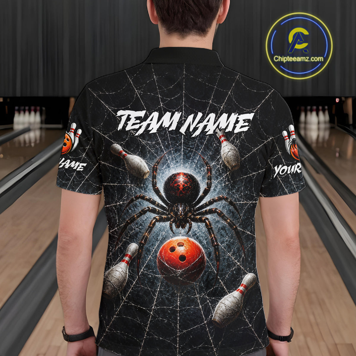 A man viewed from behind wearing a black short-sleeve bowling-themed polo shirt with a large spider and bowling ball graphic on the back, plus customizable text placeholders. The background shows a bowling alley with lanes and pins.