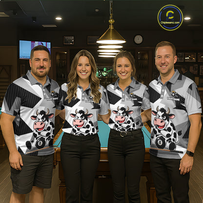 Four people wearing matching polo shirts with cow designs in a bar setting.