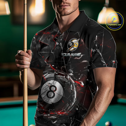 Man wearing a black collared polo shirt with shattered glass graphics, red accent streaks, a custom name area, and a large cracked 8-ball illustration across the lower front.