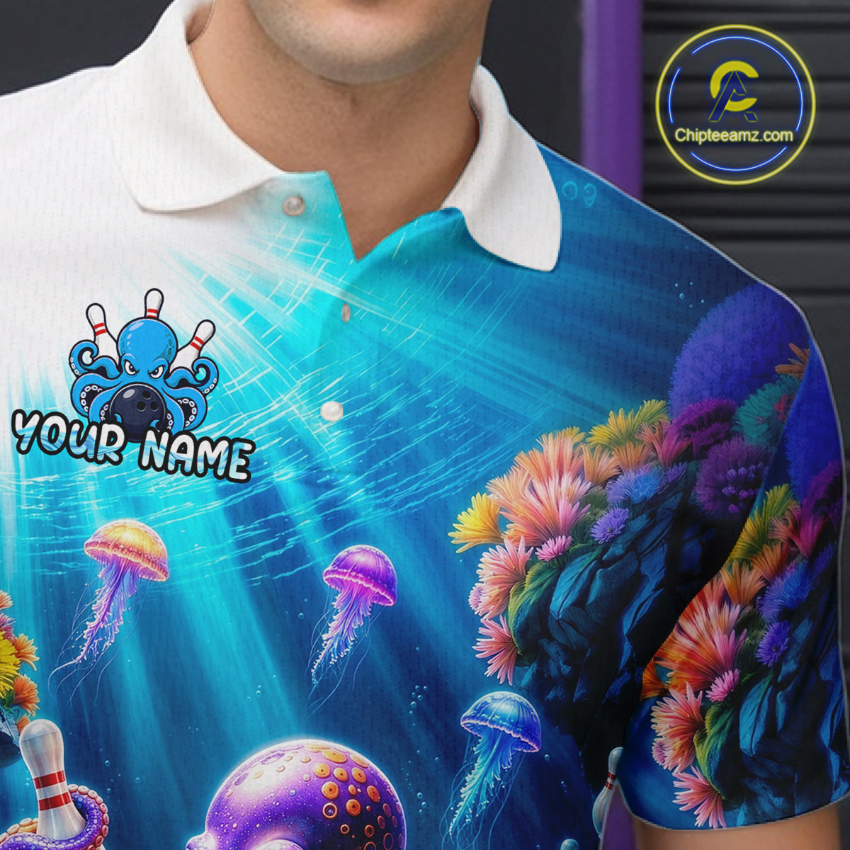 Detailed view of an ocean-themed bowling jersey showcasing bright aquatic colors, coral illustrations, floating jellyfish, and personalized name text on the chest.