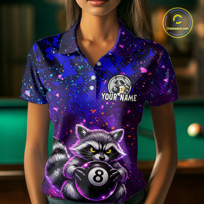 Woman wearing a colorful polo shirt with a raccoon 8 ball and 9 ball design on a pool table.
