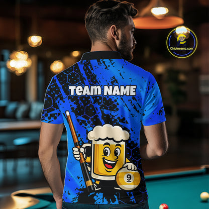 Man wearing a blue funny beer with a cartoon beer mug and pool cue design, standing in a bar.
