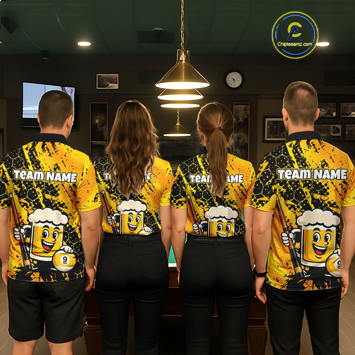 Four people wearing a bright yellow billiards polo with black splatter graphics, custom “TEAM NAME” text, and a smiling beer mug mascot holding a pool cue.