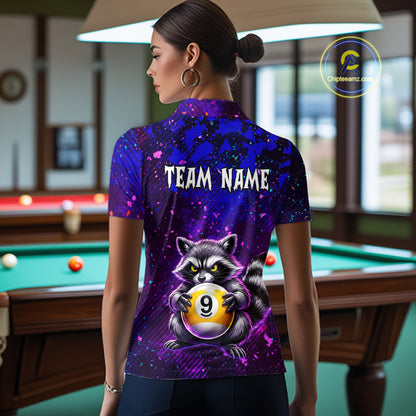 Person wearing a purple shirt with a raccoon design and 'Team Name' text in a pool hall.