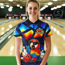 Load image into Gallery viewer, A woman stands in a bowling alley wearing a short-sleeve custom bowling shirt with a colorful geometric pattern and a large parrot graphic on the front. The shirt features a black collar and a black-and-white logo on the left chest that reads 'YOURNAME'.