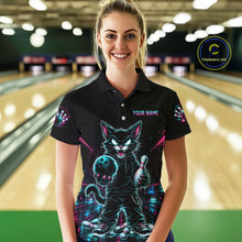 Load image into Gallery viewer, A woman stands in a bowling alley wearing a black short-sleeve polo shirt with a colorful neon cat graphic and the text 'YOUR NAME' on the chest. Bowling lanes are blurred in the background, and a circular 'Chippewanz.