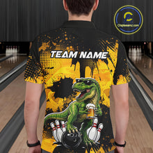 Load image into Gallery viewer, Man wearing a black bowling polo featuring a green T-Rex wearing sunglasses, holding a beer mug, standing with bowling pins and a bowling ball, plus personalized name and team name text.