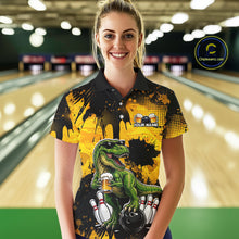Load image into Gallery viewer, Women wearing bowling polo shirt featuring a dinosaur holding beer with bowling pins and ball artwork on black yellow background.