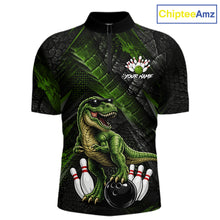 Load image into Gallery viewer, Front bowling quarter zip shirt featuring a dinosaur standing among bowling pins and ball artwork on black green textured background.