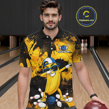 Load image into Gallery viewer, Man wearing a black and yellow bowling polo featuring a cool banana mascot dabbing, bowling pins, a blue bowling ball, and custom your name text.