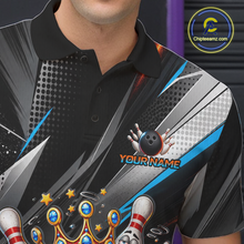 Load image into Gallery viewer, Personalized bowling polo shirt with a crowned bowling ball character surrounded by pins and angled graphic patterns across a black layout.