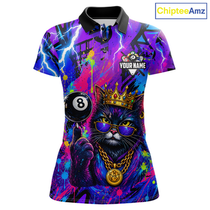A women's short-sleeve polo shirt with a vibrant, colorful graphic print featuring a black cat wearing a gold crown and sunglasses, next to a black 8-ball pool cue. The shirt has a purple, blue, and pink neon paint-splatter background with lightning bolt details.