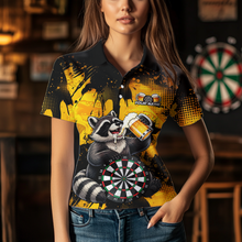 Load image into Gallery viewer, Person wearing a black and yellow darts polo featuring a raccoon drinking beer, dartboard graphics, and custom team and player name text.