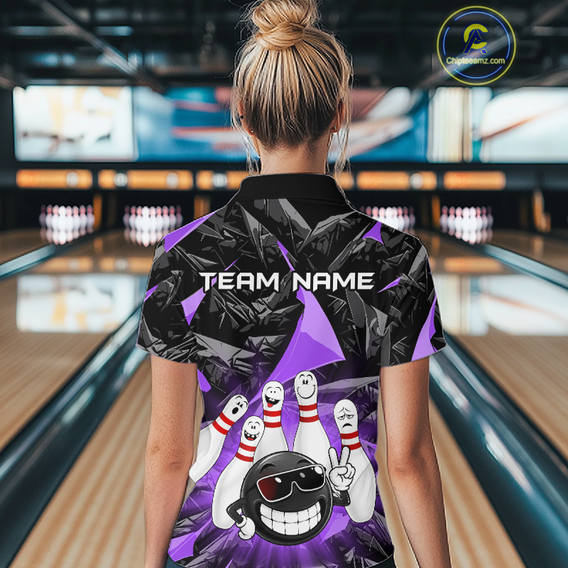 A woman viewed from behind wearing a bowling-themed short-sleeve polo shirt with a black and purple geometric pattern, bowling pins, and a bowling ball graphic. The shirt has 'TEAM NAME' printed across the upper back.