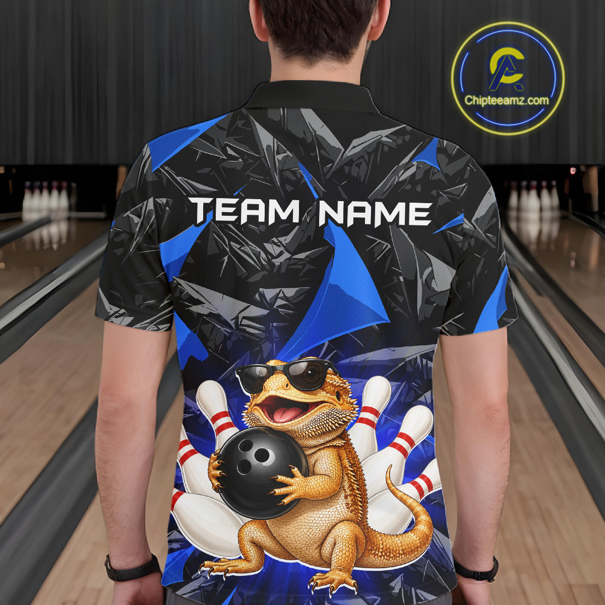 Men’s blue bearded dragon bowling polo shirt, back view on male model in bowling lane 