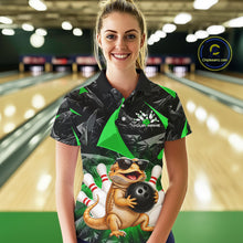 Load image into Gallery viewer, Women’s green bearded dragon bowling polo shirt, back view on female model in bowling lane 