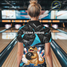 Load image into Gallery viewer, Women’s turquoise bearded dragon bowling quarter zip shirt, back view on female model in bowling lane 