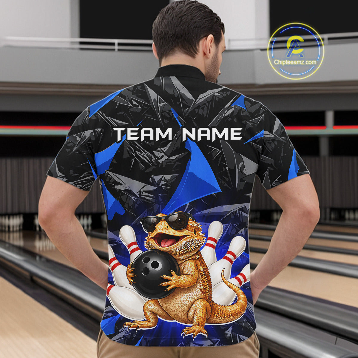 Men’s blue bearded dragon bowling quarter zip shirt, back view on male model in bowling lane 