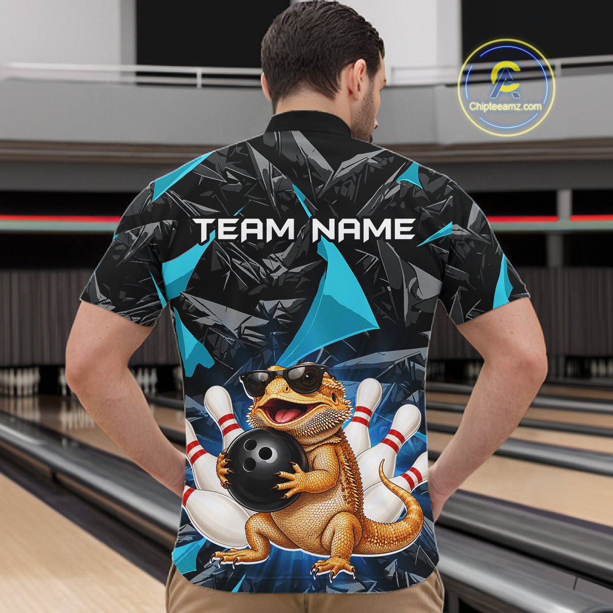 Men’s turquoise bearded dragon bowling quarter zip shirt, back view on male model in bowling lane 