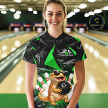 Load image into Gallery viewer, Women’s green bearded dragon bowling quarter zip shirt, front view on female model in bowling lane 