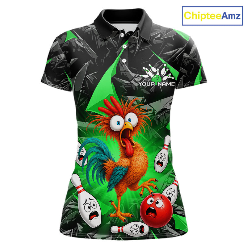 A women's short-sleeve polo shirt with a vibrant, all-over bowling-themed graphic print. The design features a cartoon rooster, bowling pins, and a red bowling ball on a green and black background with a dark bamboo pattern.