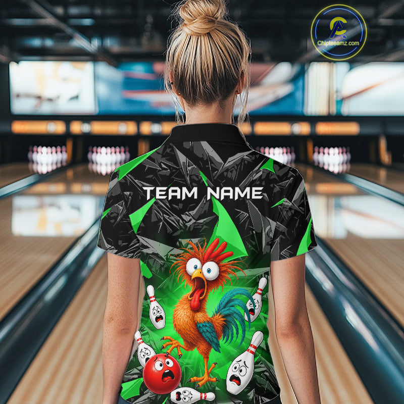 A woman viewed from behind wearing a short-sleeve bowling-themed polo shirt with a cartoon rooster, bowling pins, and red bowling balls on a green and black patterned background. Bowling lanes are visible in the blurred background, and a circular 'CustomTeeShop.
