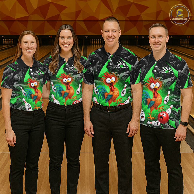 Four people standing in a bowling alley wearing matching black and green bowling shirts with a colorful cartoon rooster graphic, paired with black pants.