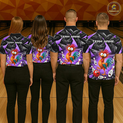 Four people standing with their backs to the camera in a bowling alley, wearing matching custom bowling shirts with a colorful cartoon rooster and skull pattern on a black background. The shirts have placeholder text 'TEAM NAME' on the back and 'TEAM NAME' on the front sleeves.
