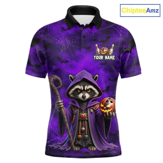 A short-sleeve polo shirt with a Halloween-themed graphic of a hooded raccoon holding a staff and a jack-o'-lantern. The shirt features a purple and black spiderweb background with the text 'YOUR NAME' and a small pumpkin graphic on the chest.