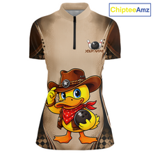 Load image into Gallery viewer, Beige shirt with a cartoon duck wearing a cowboy hat and holding a bowling ball, branded 'ChipteeAmz'.