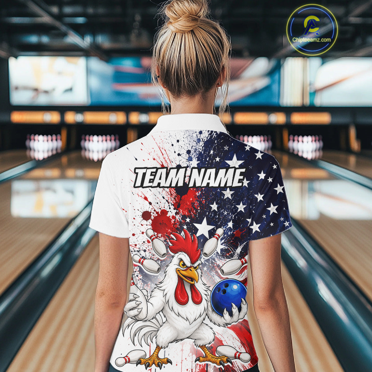Women’s us flag chicken bowling polo shirt, back view on female model in bowling lane 