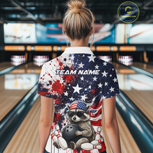 Load image into Gallery viewer, Women’s us flag raccoon bowling quarter zip shirt, back view on female model in bowling lane 
