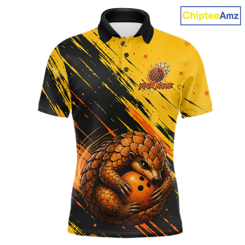 A short-sleeve polo shirt with a black and yellow brushstroke design, featuring a large 3D-style pangolin graphic wrapping around a bowling ball on the front. The shirt has a black collar and buttons, and a 'ChipteeAmz' logo is visible in the top right corner.