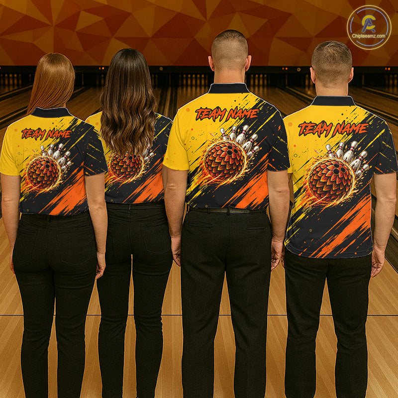 Four people standing with their backs to the camera in a bowling alley, wearing matching bowling shirts with a custom bowling ball graphic and 'TEAM NAME' text. The shirts are yellow and black with orange and red graphic details.
