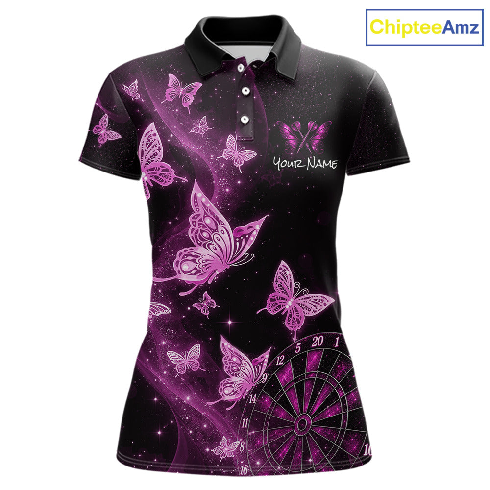 A women's short-sleeve polo shirt with a black base and a vibrant purple and pink butterfly and starry galaxy print. The shirt features a custom name placeholder on the left chest and a dartboard graphic on the lower right.