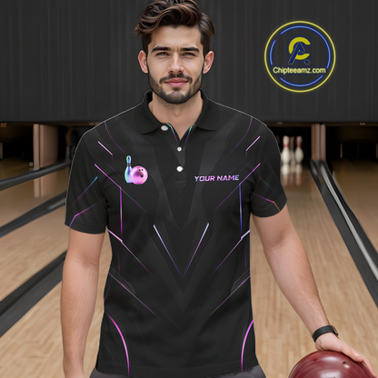 Man wearing a black bowling shirt with colorful designs on a bowling alley.
