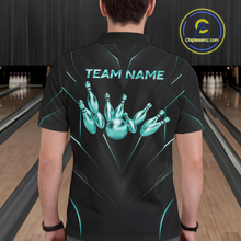 Load image into Gallery viewer, Person wearing a black bowling shirt with teal graphics and 'TEAM NAME' text in a bowling alley.