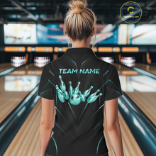 Load image into Gallery viewer, Person wearing a black bowling shirt with 'TEAM NAME' and bowling pin design in a bowling alley.