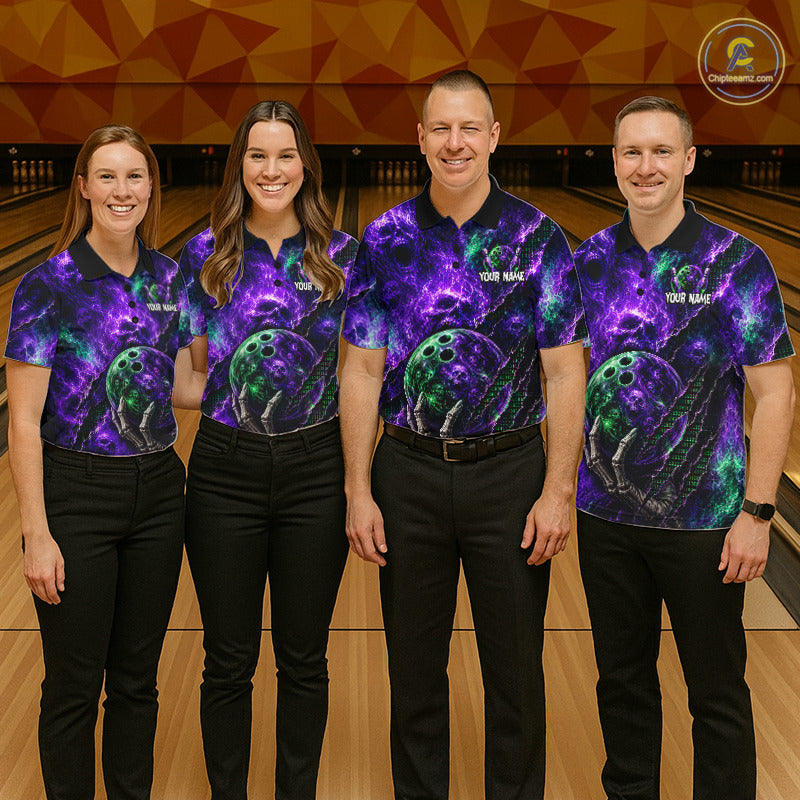 Four people standing on a bowling lane wearing matching short-sleeve bowling shirts with a purple, blue, and green cosmic/nebula print and bowling ball graphics. The shirts have dark navy collars and sleeves, and the men's shirts also have dark pants.