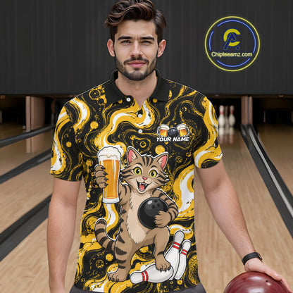 A man wearing a black and yellow bowling-themed short-sleeve polo shirt with a cartoon cat holding a beer glass and bowling ball, standing in a bowling alley. 