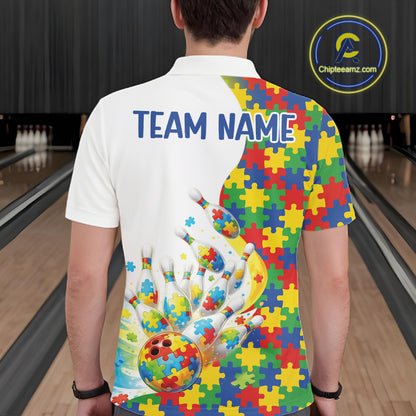 Male model at a bowling lane, back view of white polo shirt showcasing autism-themed bowling strikes with colorful puzzle graphics